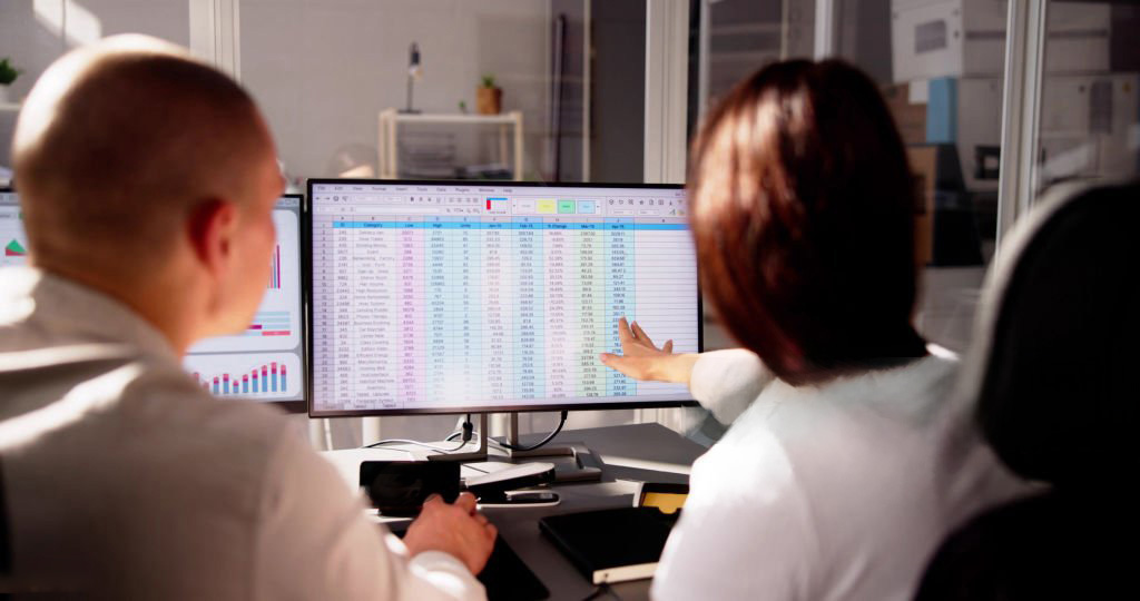 Professionals analyzing medical financial accounts